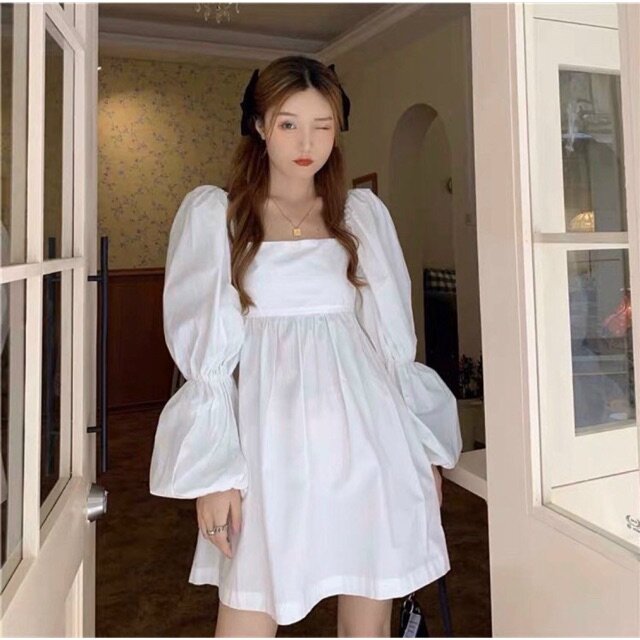 Đầm trắng cổ vuông tay bo chun nơ lưng