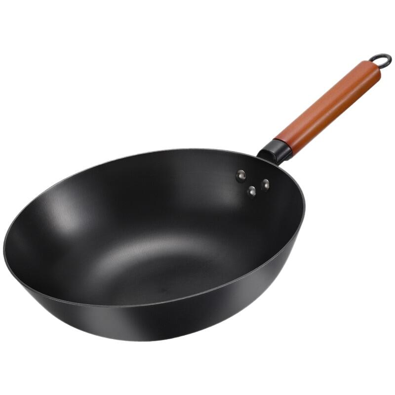 carbon steel wok on electric stove