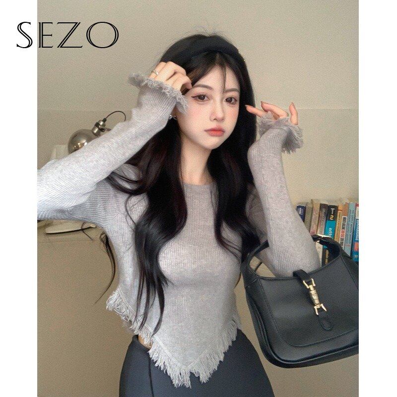 Sezo áo len ngắn tay cổ tròn tua rua bất đối xứng cho nữ