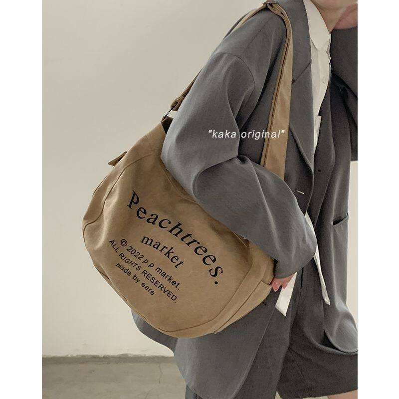 Mới retro khaki bảng chữ cái túi sinh viên túi đeo vai công suất lớn balo balo nữ đi hoc tui đeo chéo cho nam ibg073